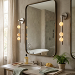 Alabaster Orb Asteria Brass Wall Sconce