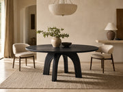 Kael black oak round dining table in a quiet organic modern dining room